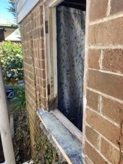 Timber window frame repair in progress